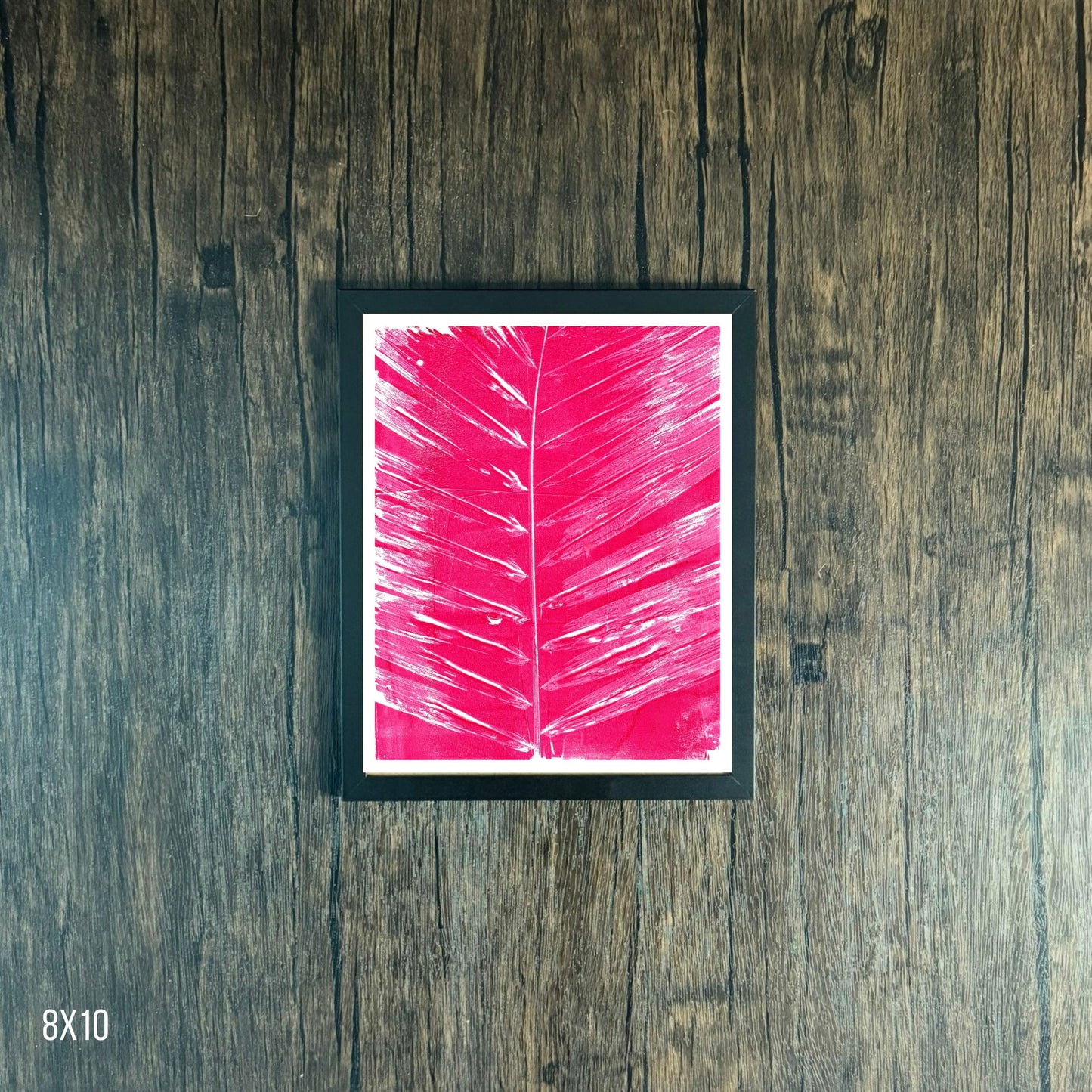 Framed Magenta leaf print on wooden background, 8x10