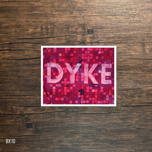 Poster with 'DYKE' text on a pink mosaic pattern against a wooden background