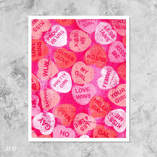 Colorful candy heart pattern on a textured gray background