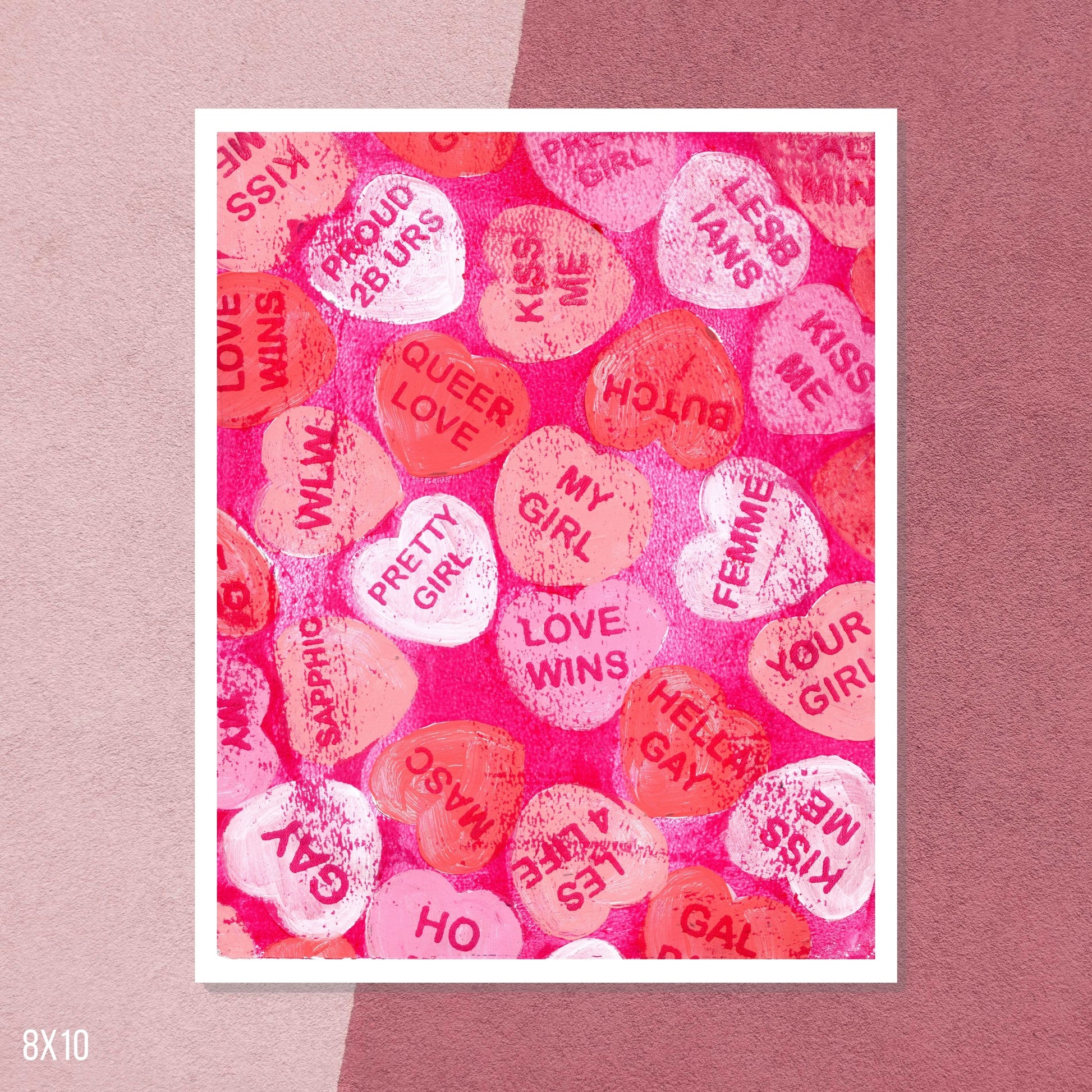 Art print with colorful heart-shaped text on a pink background